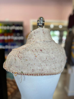 closeup image of the neckline and shoulder of  handknit sweater