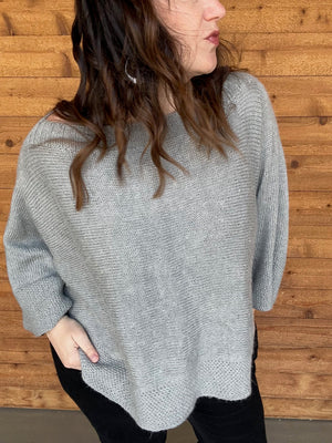 closeup image of the fabric of a handknit poncho