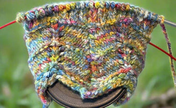 closeup image of chevron stitch pattern on  handknit socks