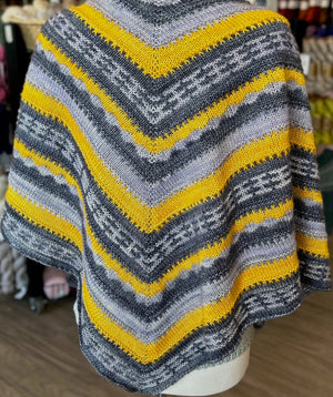 closeup image of 3-color stripe patterned handknit shawl
