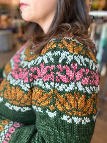 closeup image of 4-color patterned handknit sweater yoke