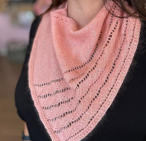 closeup image of a lace pattern bandana-shaped handknit cowl
