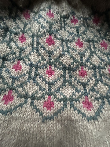 closeup image of the colorwork yoke of a pullover handknit sweater