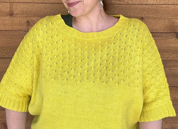 closeup image of the fabric of a handknit top