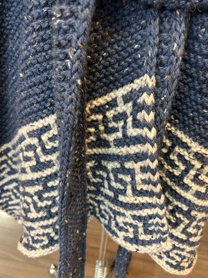 closeup image of the lace and textured yoke of pullover handknit sweater