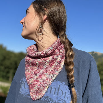 young woman models handknit cowl outdoors