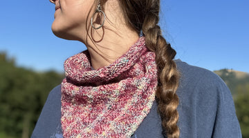 young woman models handknit cowl outdoors