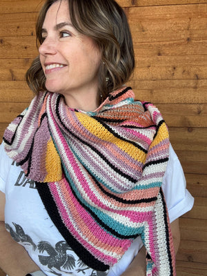 closeup image of a cotton striped handknit shawl