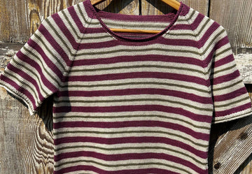 closeup image of the striped fabric of a  handknit top