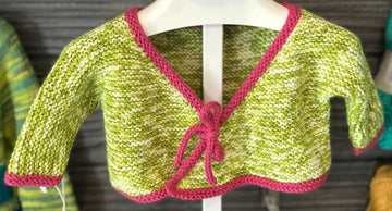 wrap front of a handknit baby sweater