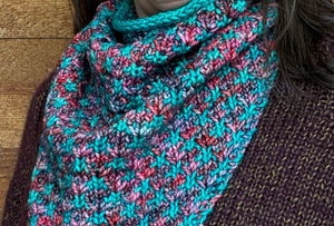 closeup image of the fabric of a 2-color handknit cowl