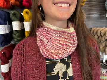 closeup image of a textured and striped handknit cowl