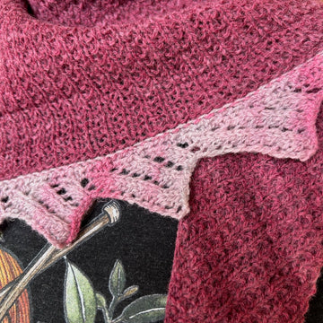closeup image of textured and lace handknit shawlette
