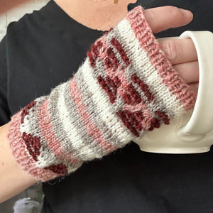 closeup of 4-color colorwork handknit fingerless mitts