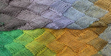 closeup image of textured multicolor handknit scarf fabric
