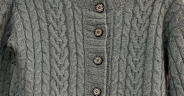 closeup image of the fabric of a handknit cardigan