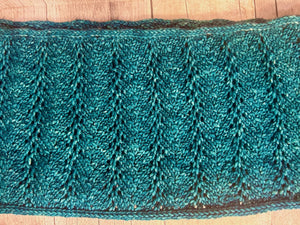 closeup image of a lacework fabric of a handknit cowl