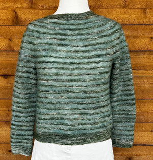 closeup image of the fabric of a handknit sweater