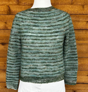 closeup image of the fabric of a handknit sweater