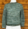 closeup image of the fabric of a handknit sweater