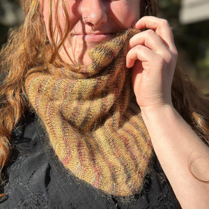 closeup image of a double-layer, striped handknit cowl