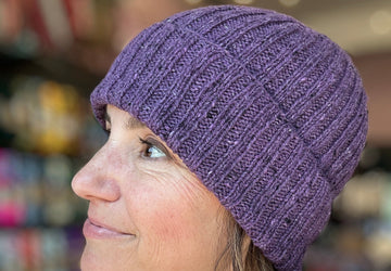 closeup image all-over ribbing fabric of a handknit hat