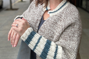 closeup image of 3-color marled and striped handknit sweater 