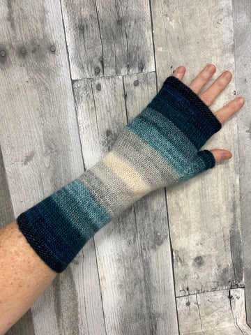 blue tonal striped handknit fingerless mitts at a local yarn shop