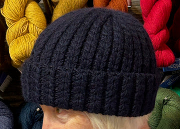 closeup image of the fabric of a textured handknit hat