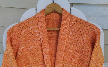 closeup image of the fabric of a handknit sweater