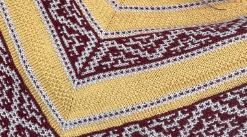 closeup image of 3-color patterned handknit shawl
