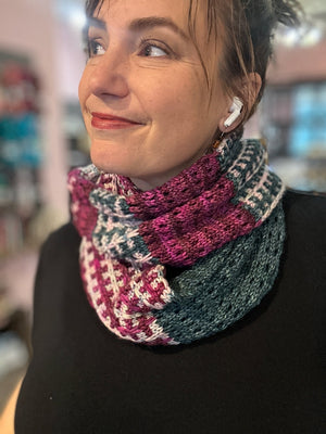 closeup image of a tri-color textured fabric of a handknit cowl