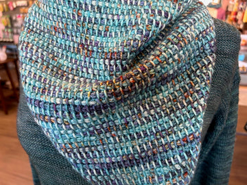 close-up of two-color Tunisian crochet simple stitch fabric on a crocheted cowl