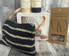 Paloma handknit clutch displayed with kit and optional handles