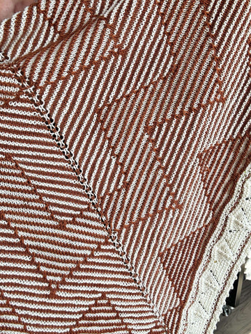 close-up of two-color shadow knitting effect handknit shawl