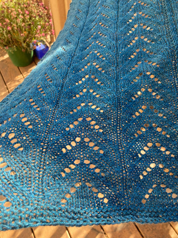 closeup image of lace and textured handknit shawl