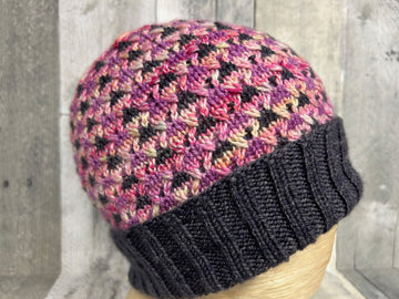 closeup image of a textured colorwork handknit hat