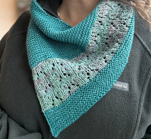 2-color bandana style handknit cowl modeled on a woman