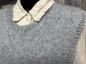 closeup image of the fabric of a handknit vest