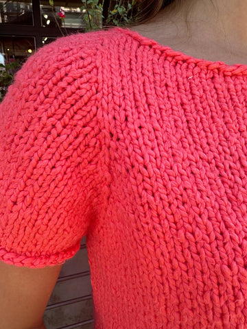 closeup image of the fabric of a handknit top
